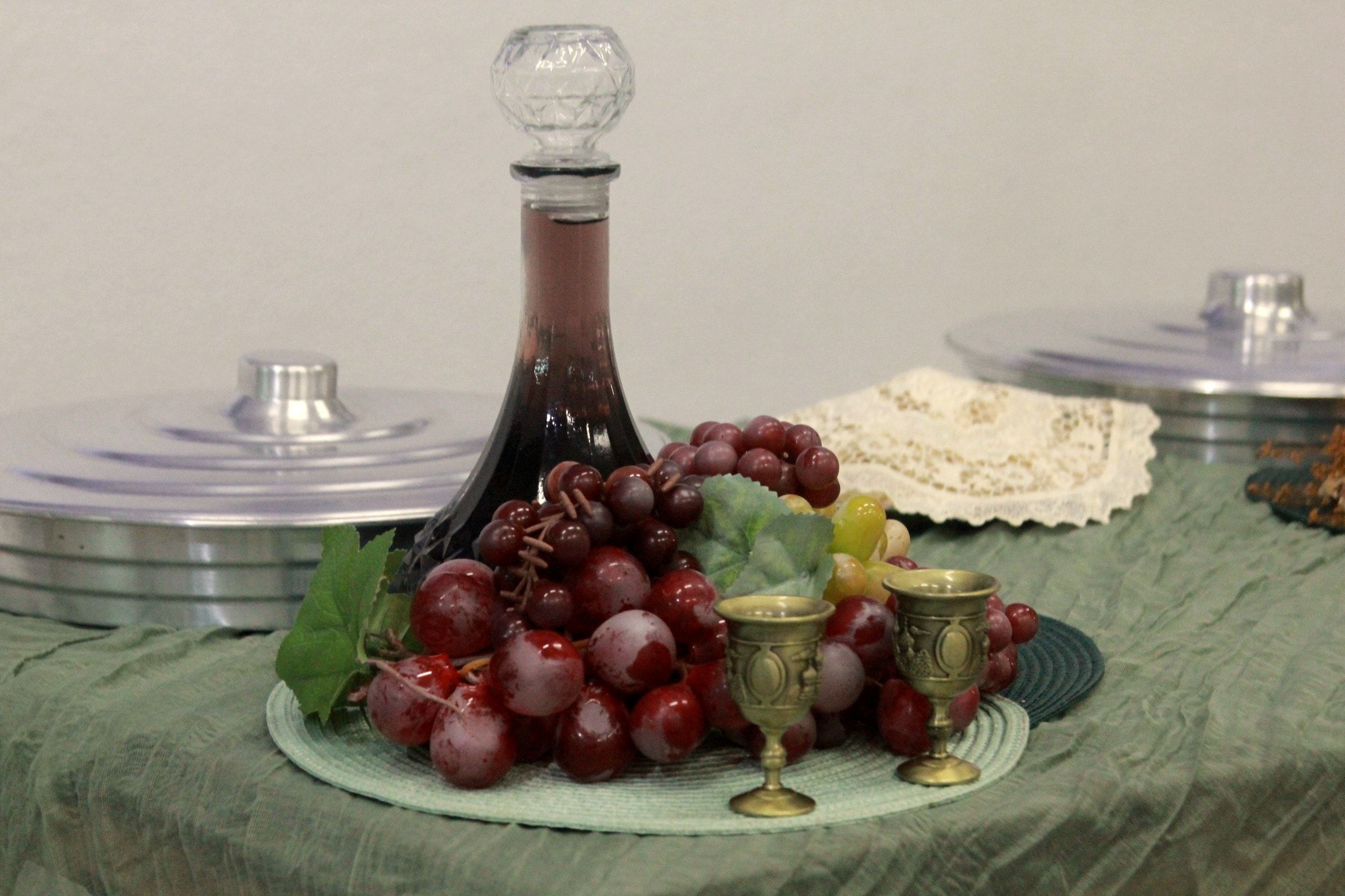A mesa da Ceia: o pão, o vinho e as uvas